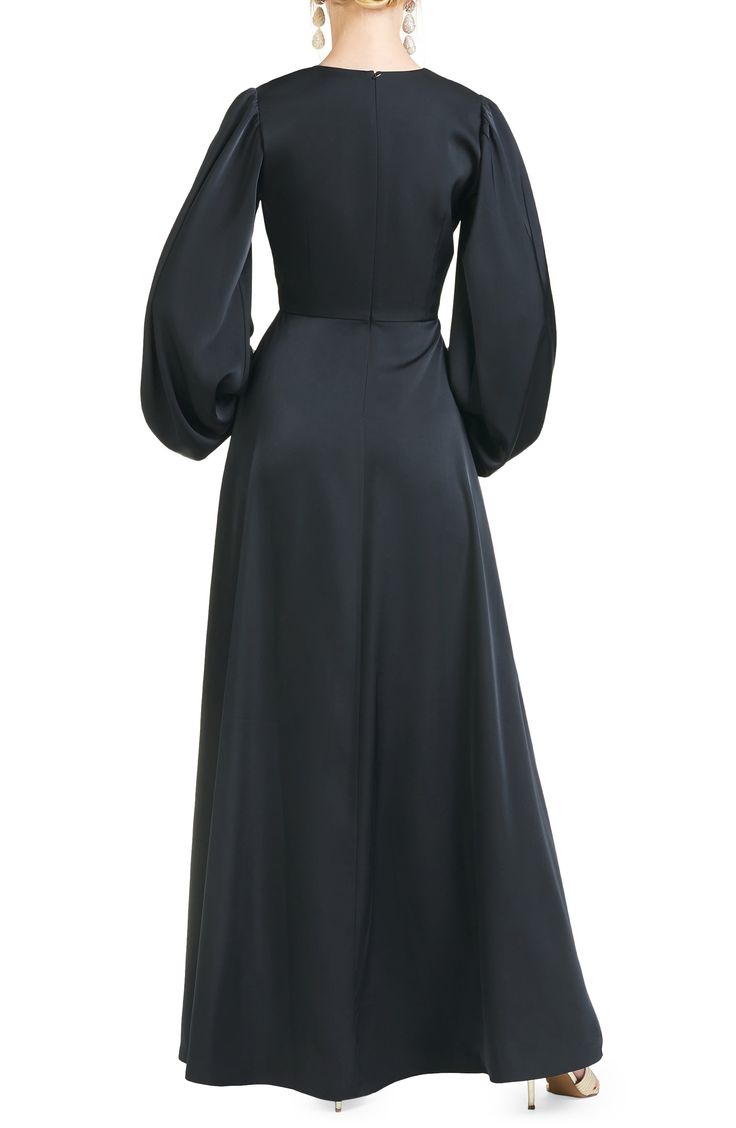 Billowed sleeves add a dramatic touch to this satin gown styled with a sweeping skirt. 62" length V-neck Long sleeves Lined 100% polyester Dry clean Imported Knee Length Evening Dress, Empire Waist Gown, Sachin Babi, Evening Dresses With Sleeves, Black Satin Dress, Long Balloons, Dress Home, Satin Gown, Gowns With Sleeves