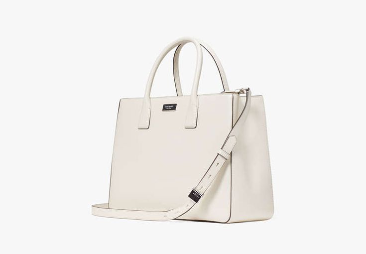 It all started with Sam the first bag we launched back in 1993. It's been a perennial crowd favorite and a key part of our heritage ever since. Our Sam Icon tote brings back the original design from 1993 in shiny Saffiano leather. You know what they say...once an icon always an icon. | Kate Spade Sam Icon Large Tote, Parchment Classic Medium Shoulder Bag With Removable Pouch, Modern Kate Spade Satchel For Everyday Use, Kate Spade Classic Luxury Satchel, Kate Spade Luxury Rectangular Satchel, Classic Medium Shoulder Bag With Top Carry Handle, Classic Medium Shoulder Bag With Top Handle, Classic Medium Shopping Bag, Classic Kate Spade Tote Satchel, Kate Spade Classic Bag For Everyday Use