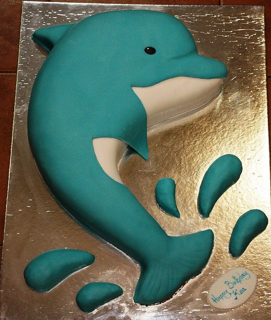 there is a cake shaped like a dolphin