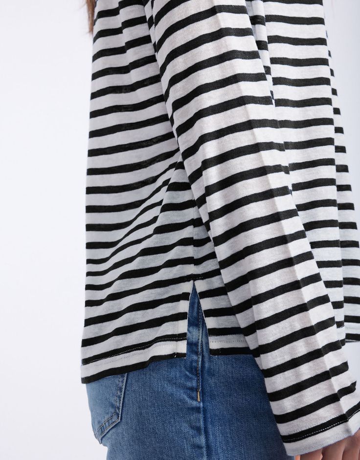 DESCRIPTION Embrace casual comfort with the Long Weekend Top in White/Black Stripe by White & Co. This top is designed for comfort and style, featuring a relaxed fit, crew neckline, and long sleeves. The crisp white base with black stripes brings a classic look perfect for casual days. This top ensures all-day comfort, making it an ideal choice for weekend wear or a relaxed day out. Team the Long Weekend Top with rolled-up jeans and white sneakers for a casual yet chic look. This versatile top s Jeans And White Sneakers, Rolled Up Jeans, Weekend Wear, Long Weekend, White Sneakers, Classic Looks, Black Stripes, Long Tops, Stripes Pattern