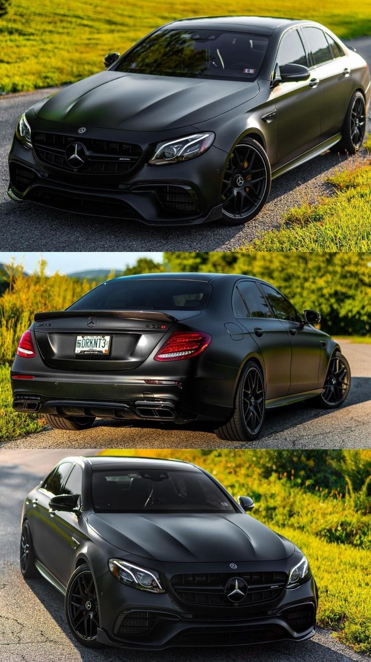 three different cars parked on the side of a road in front of some grass and bushes