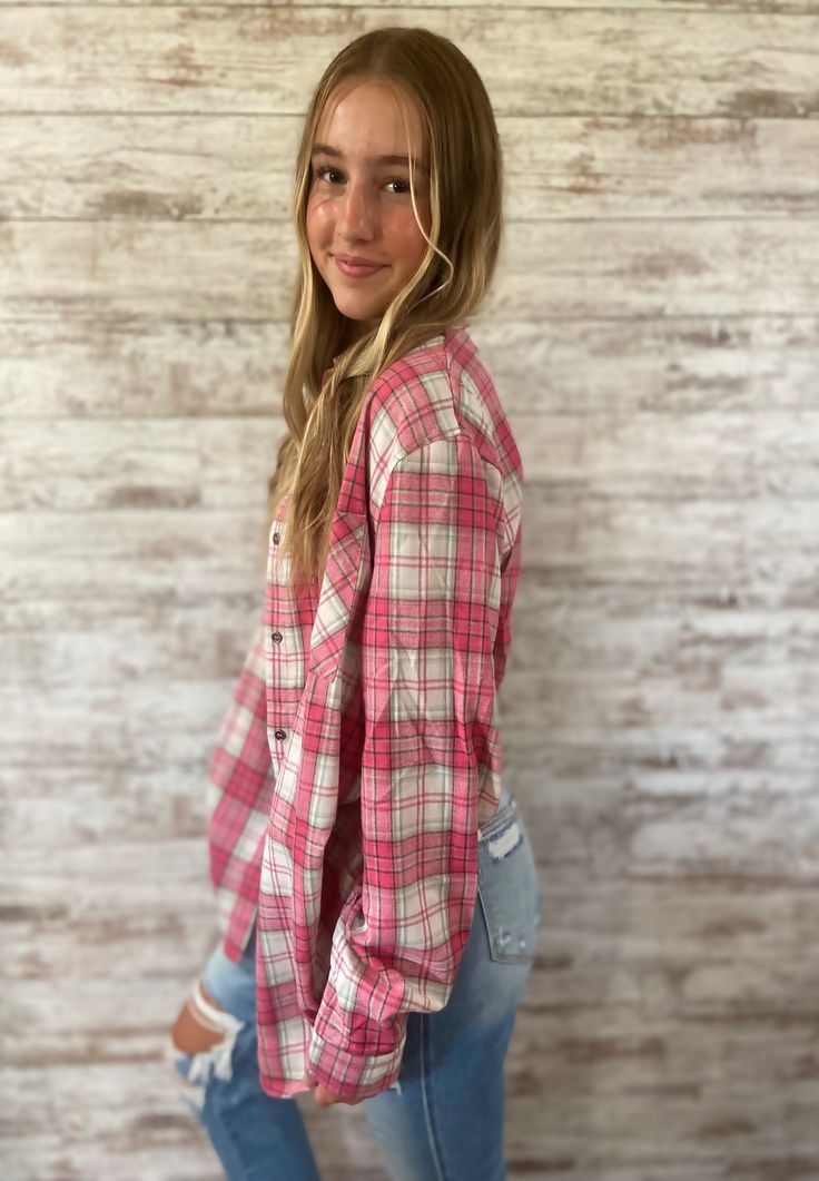 Stay comfy and stylish in this soft and lightweight daily flannel shirt featuring a classic plaid print. This regular fit shirt is perfect for everyday wear and our model looks fantastic in a size small, making it a must-have addition to your wardrobe for a trendy and effortless look!- Model Spec: Model is wearing a size small.- Style: Casual- Feature: Daily flannel shirt- Print/ Pattern: Plaid- Neckline: Collar- Silhouette: Shirting- Embellishment: Buttoned cuffs and a patch pocket - Length: To Trendy Relaxed Fit Flannel Shirt, Trendy Flannel Button-up Shirt, Pink Button-up Flannel Shirt For Fall, Casual Flannel Shirt For Spring, Summer Everyday Cotton Flannel Shirt, Summer Cotton Flannel Shirt For Everyday, Everyday Summer Cotton Flannel Shirt, Trendy Button-up Flannel Top, Plaid Button-up Top For Casual Gatherings