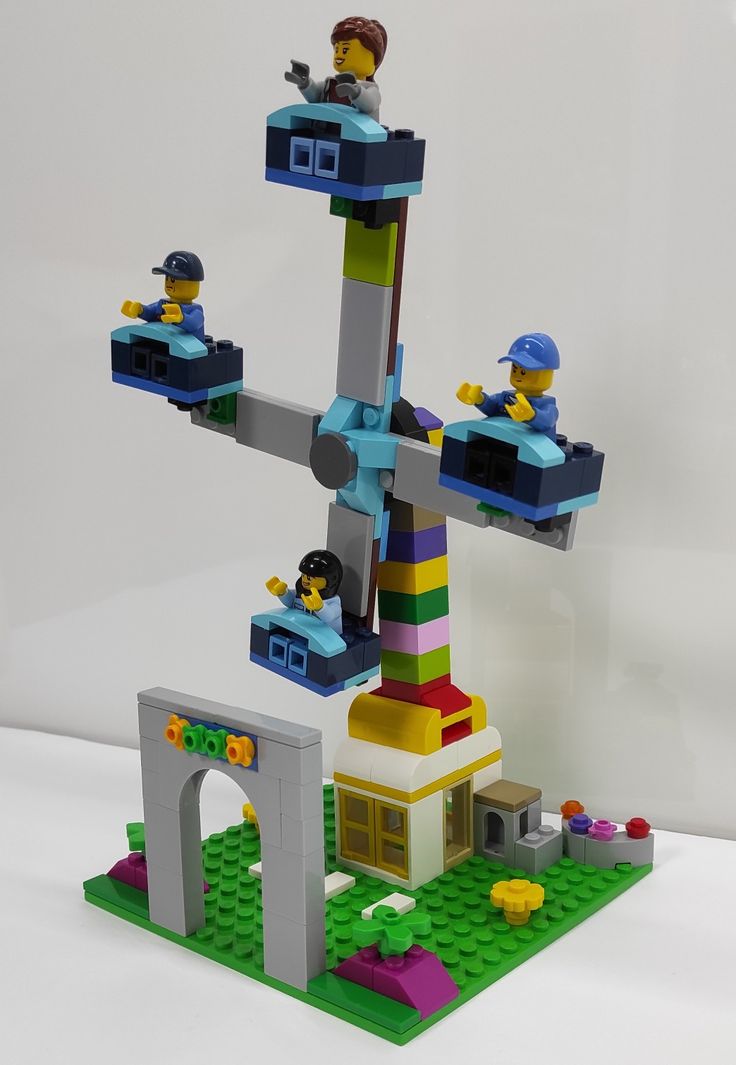 a lego tree is shown with people on it's top and bottom part in the middle