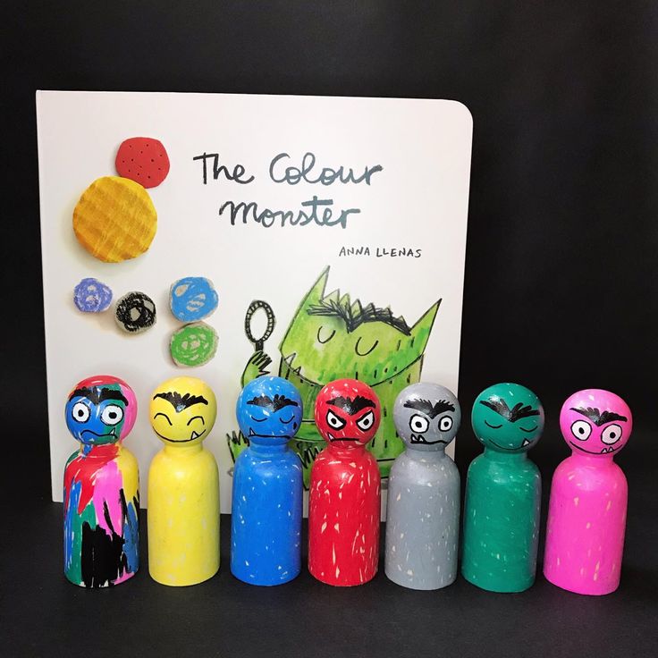 an assortment of toys and magnets are displayed in front of a sign that says the golemur monster