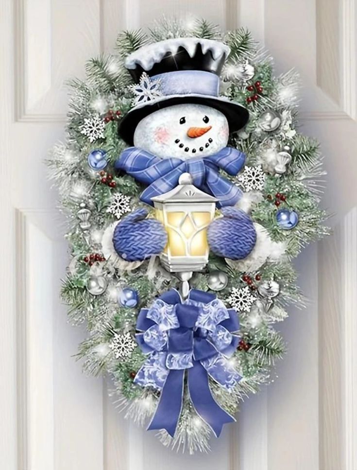 a christmas wreath with a snowman holding a lantern