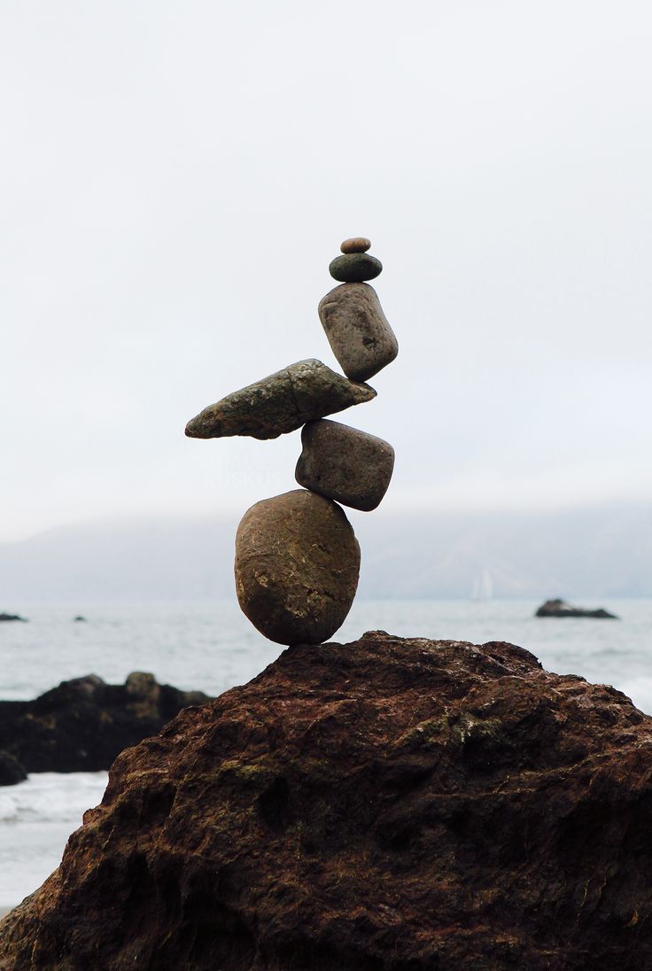 rocks stacked on top of each other near the ocean