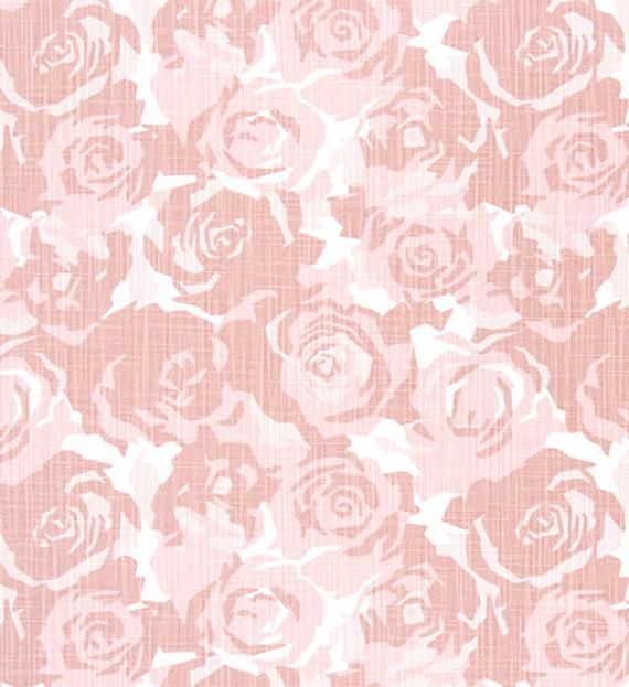 a pink and white rose pattern on fabric, with the background in shades of light pink