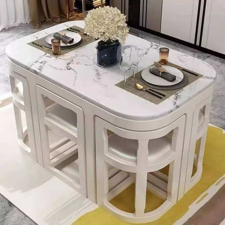 a white marble dining table with gold accents