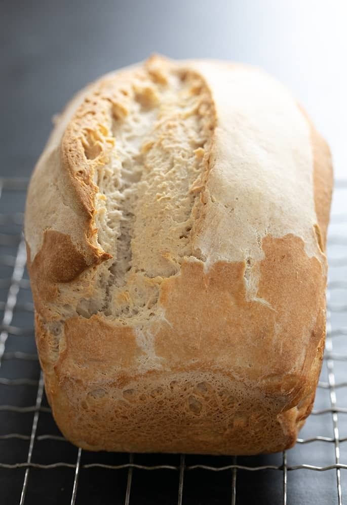 a loaf of bread sitting on top of a cooling rack