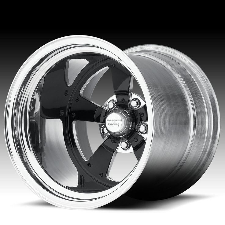 an image of a wheel on a black and white background with the wheels in chrome