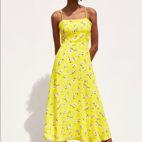 Yellow Zara Dress With Purple Flowers. Midi Length With Zipper On Side. Never Worn. Measurements Upon Request. For Styling Ideas Check Out Revolve, Aritzia, Zara, Reformation, Miaou, Asos, Agolde, Levi’s, Steve Madden Yellow A-line Dress For Summer, Yellow Floral Midi Dress For Vacation, Yellow Midi Floral Dress For Vacation, Yellow Floral Dress For Spring, Spring Yellow Floral Print Midi Dress, Yellow Fitted Midi Dress For Garden Party, Fitted Yellow Midi Dress For Garden Party, Yellow A-line Sundress, Yellow A-line Summer Dress