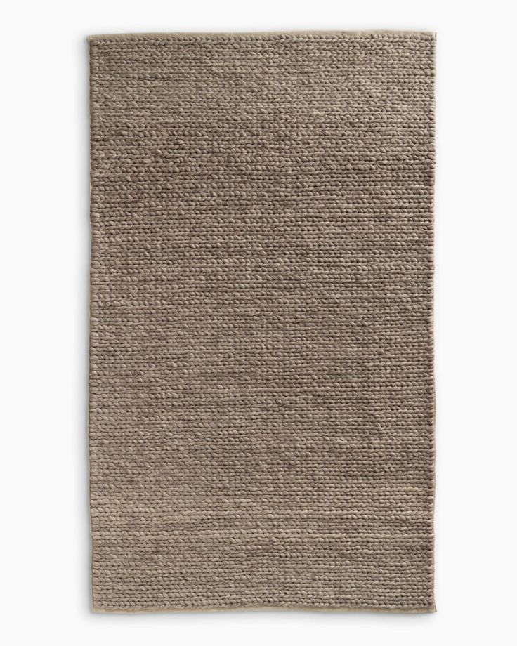 a beige rug on a white background