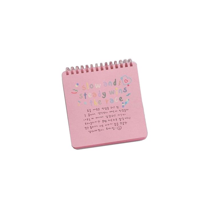 a pink spiral notebook with writing on it