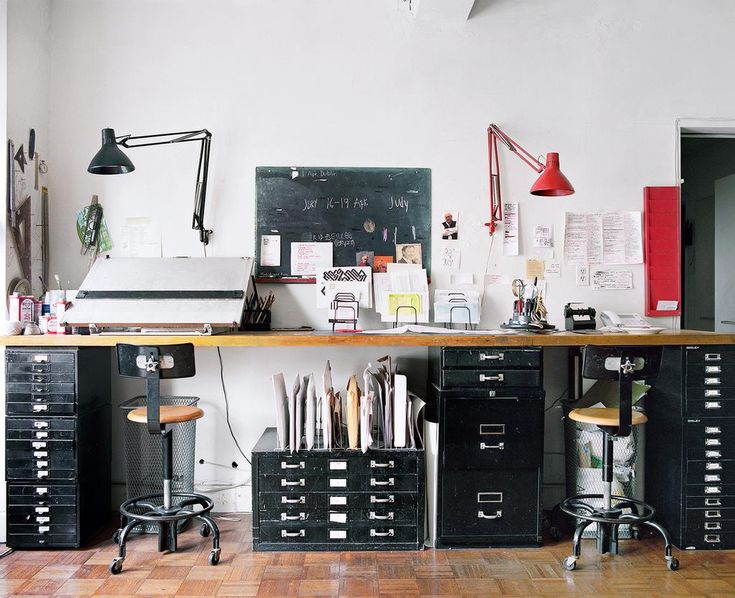 an office with lots of drawers and desks