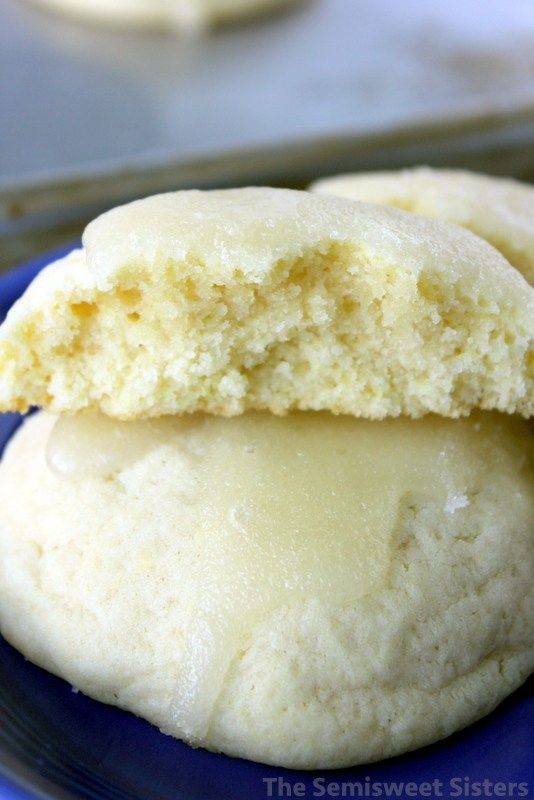 two sugar cookies are on a blue plate