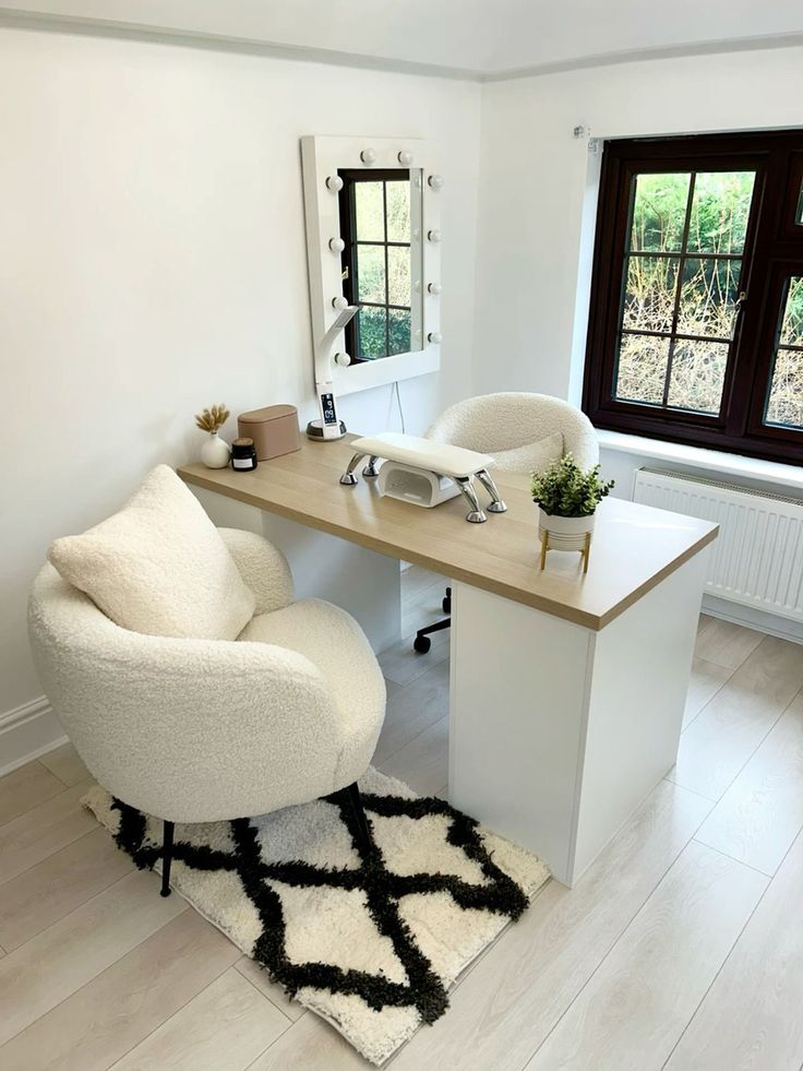 a white chair sitting in front of a desk with a mirror on top of it