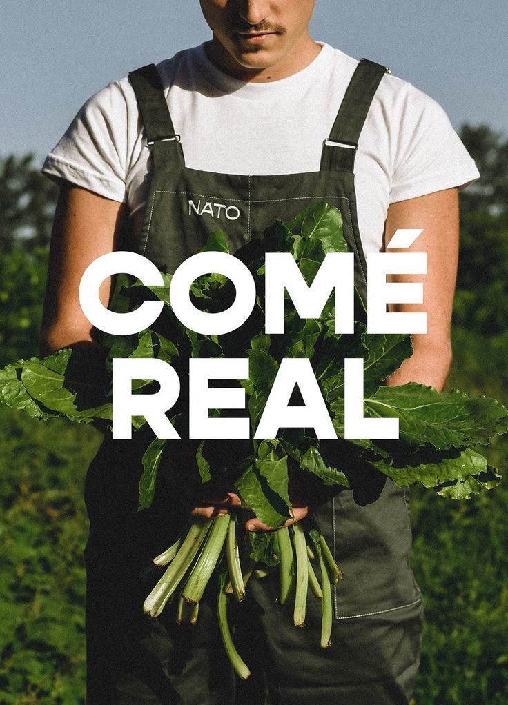 a man is holding some green vegetables in his hands with the words come real on it