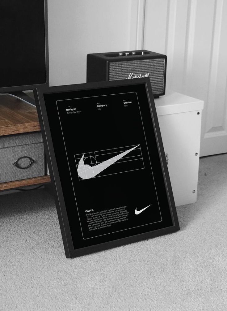 a black and white photo with the nike logo on it next to an old radio