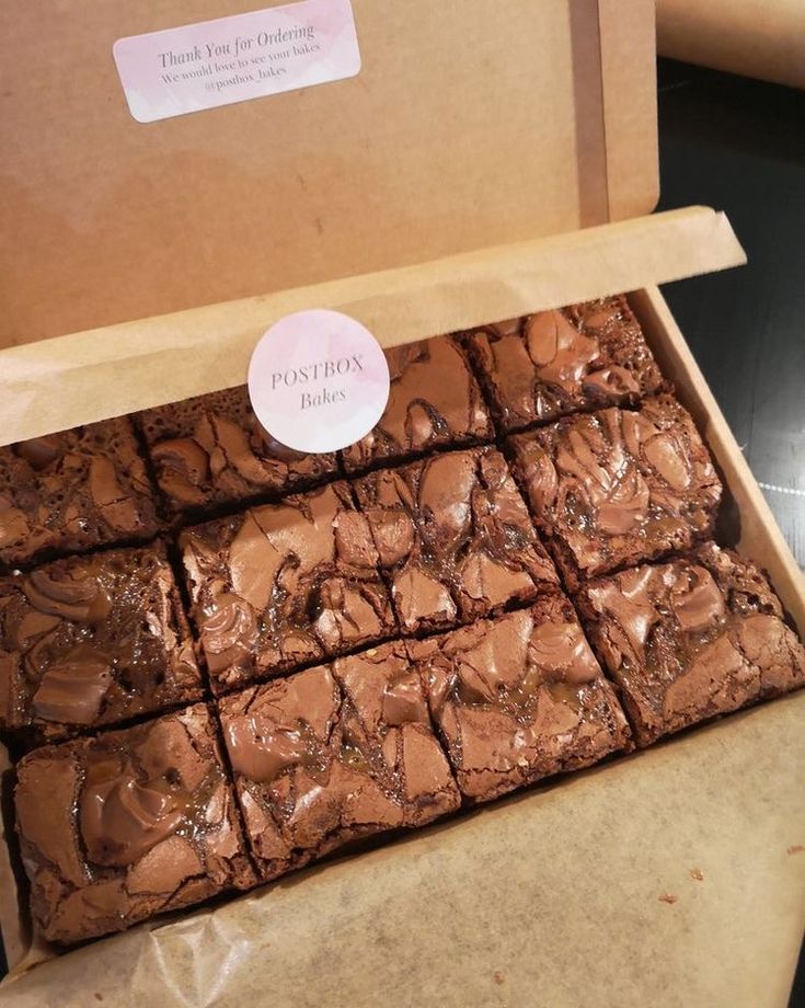 a box filled with brownies sitting on top of a counter