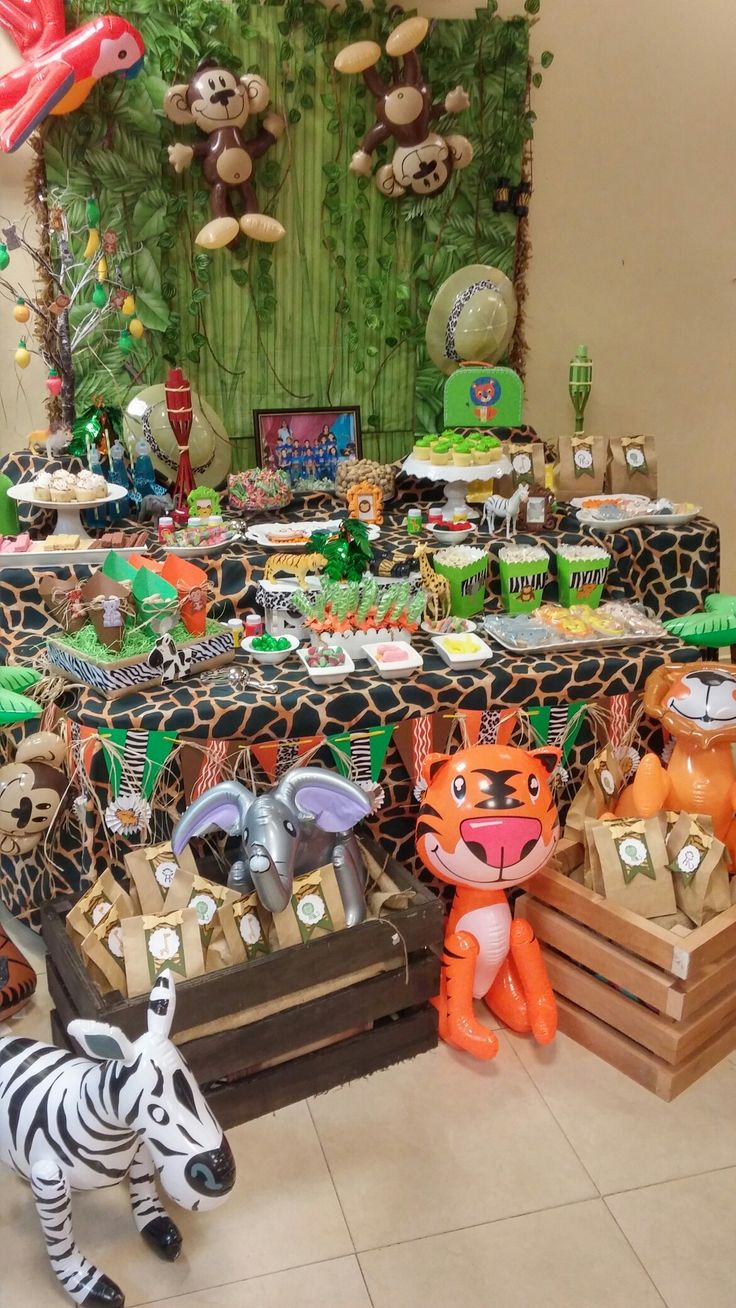 an animal themed birthday party with zebras, giraffes and other decorations