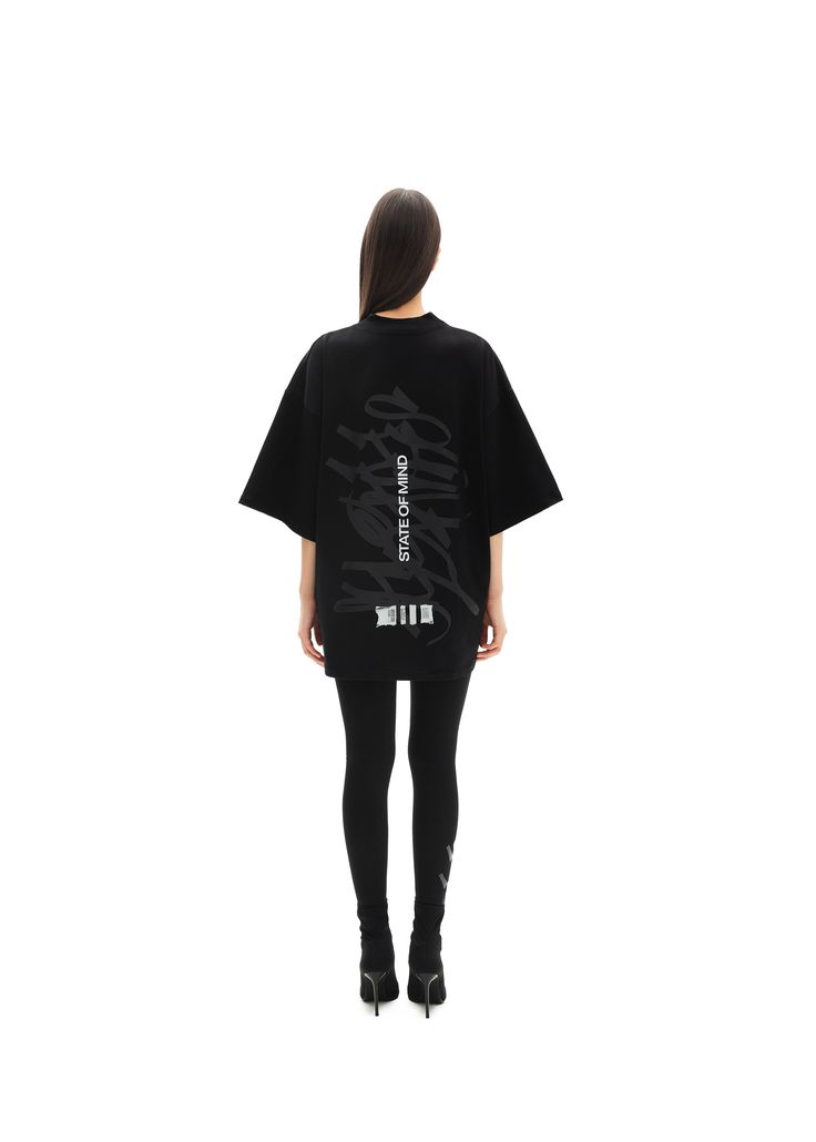 Oversized unisex t-shirt. Features a minimalistic print in GRAFFITI edition. Material: 95% cotton, 5% elastane Models: Model woman wears: S size Model's height: 173 cm Model man wears: XL size Model's height: 187 cm Oversized Edgy T-shirt For Fall, Black Boxy Top With Text Print, Black Boxy Fit Top With Text Print, Oversized Black Graphic Design Tops, Oversized Graphic T-shirt For Fall, Oversized Black Tops With Graphic Design, Oversized Logo Print Tops For Loungewear, Oversized Black Graphic Tops, Black Boxy Fit Top With Logo Print