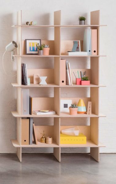 a bookshelf filled with lots of different types of things on top of it