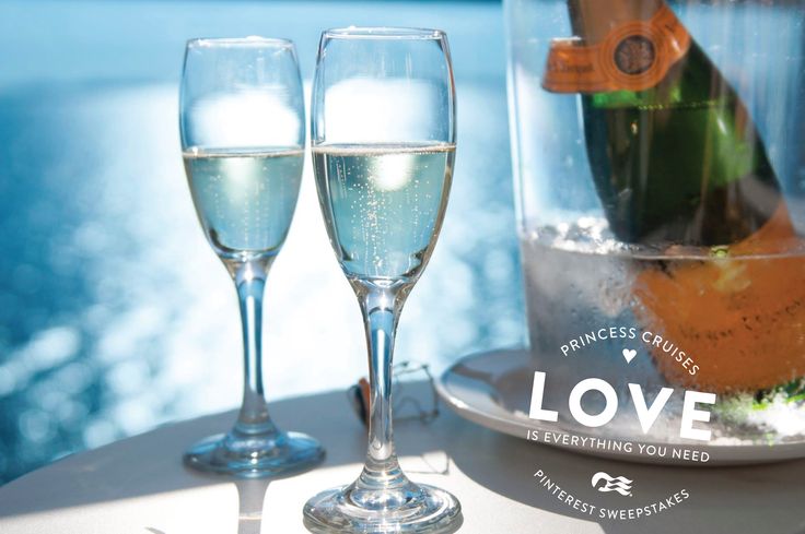 two champagne glasses sitting on top of a table