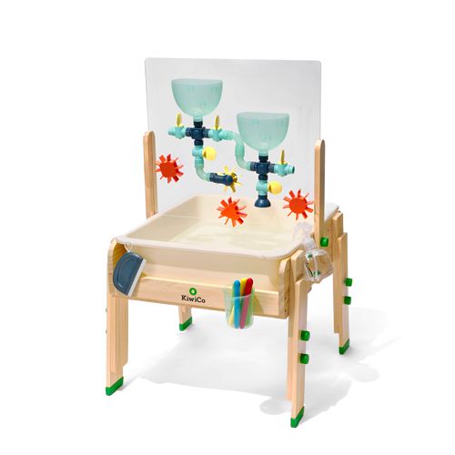 a child's wooden chair with two glasses on it