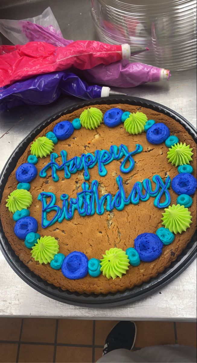 a birthday cake with the words happy birthday written on it