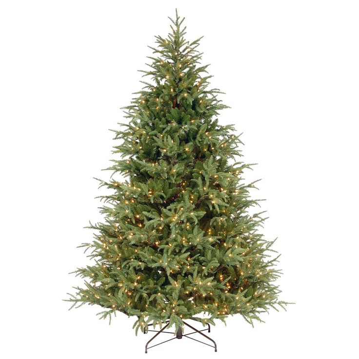 a small christmas tree with lights on it's top and bottom branches, in front of a white background