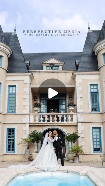 a bride and groom standing in front of a large building