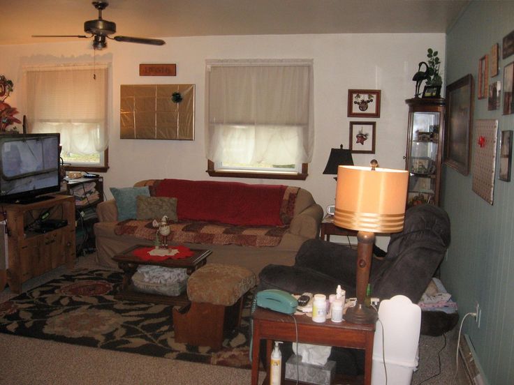 a living room filled with furniture and a flat screen tv