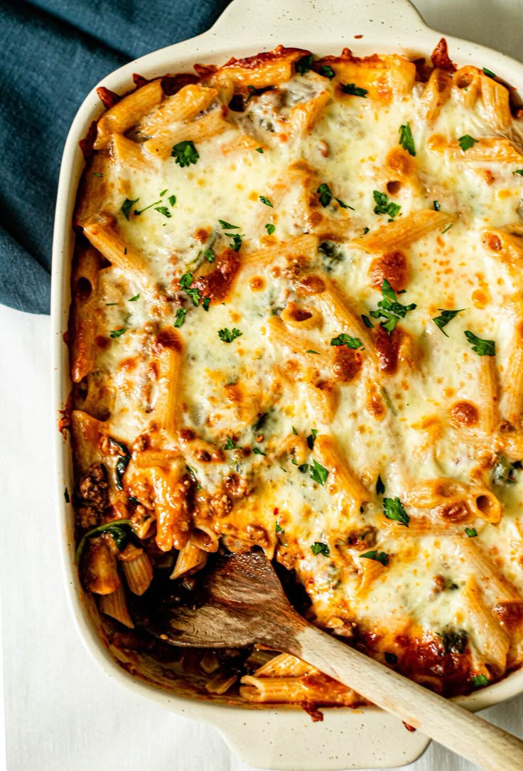 a casserole dish filled with pasta and cheese