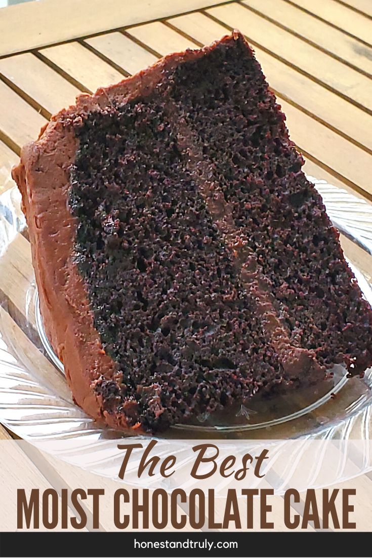 a piece of chocolate cake sitting on top of a glass plate with the words, the best moist chocolate cake