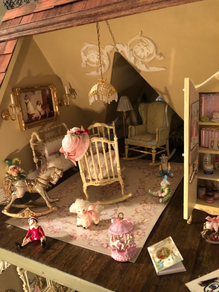 a doll house with furniture and accessories on the floor