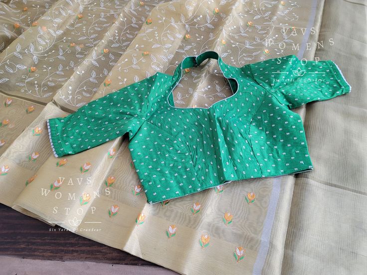 Blouse stitched - Yes Blouse Opening - Back Sleeves Length - Elbow Padded - No Blouse size - 38 with inner margins expandable upto 44 For Blouse Size 36 alteration can be done on request. Fall/pico - Yes done All over embroidery work comes only for Pallu part. Green Cutdana Blouse For Summer, Green Long Sleeve Blouse With Self Design, Green Cotton Blouse With Cutdana, Green Long Sleeve Self-design Blouse, Gold Slub Silk Blouse Piece With Pallu, Gold Tussar Silk Blouse With Pallu, Fitted White Cotton Silk Blouse, Green Summer Blouse With Cutdana Details, Green Padded Cotton Blouse