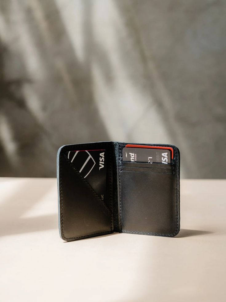 Introducing the ABLE Freddie Card Wallet in sleek black leather. Stay organized and stylish with this functional yet fashionable wallet. Perfect for keeping your cards and cash in one place on-the-go. The Freddie Card Wallet - Character Making, Leather Card Wallet, Funny Socks, Craft Accessories, Leather Texture, Wallet Fashion, Gift Ideas For Men, Leather Care, Small Leather Goods