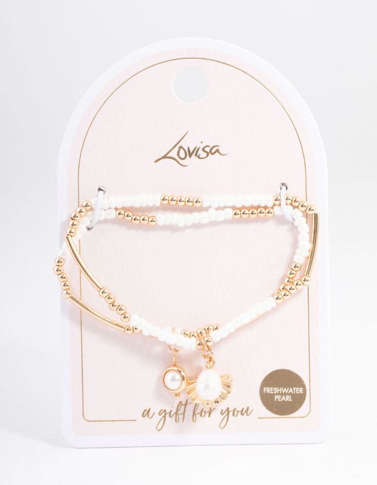 Gift your nearest and dearest an affordable gift to remember! Explore memorable gifts from our Value Gifting collection and spoil your loved ones for the festive season. Choose from timeless pendant necklaces, beloved bracelets or our versatile collection of jewellery sets that have it all. | Lovisa Gold Beachy Beaded Bracelet 2-Pack Bracelet Pack, Jewellery Sets, Affordable Gifts, Favorite Rings, Memorable Gifts, Festive Season, Ring Necklace, Alex And Ani Charm Bracelet, Festival Season