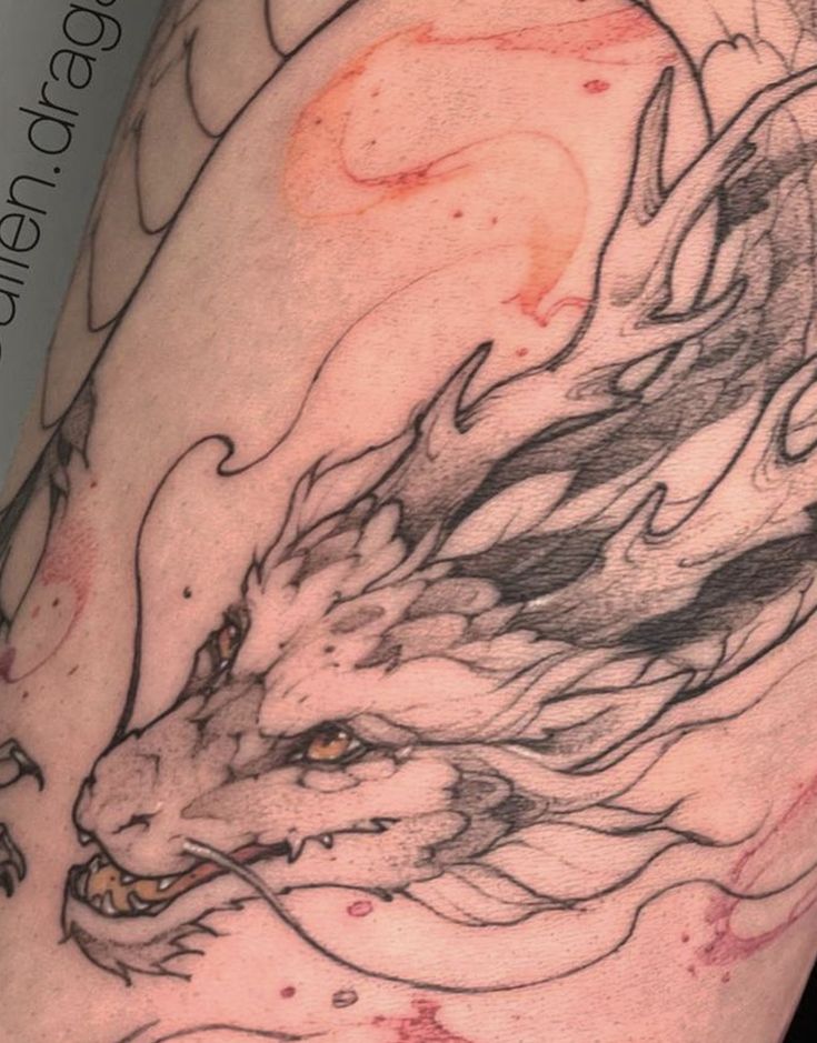 a close up of a person's arm with a tattoo on it and an animal