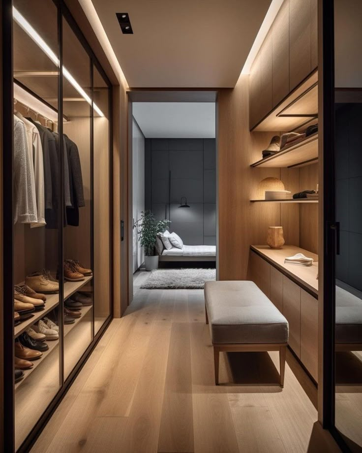 a walk - in closet with wooden shelves and shoes on the floor next to it