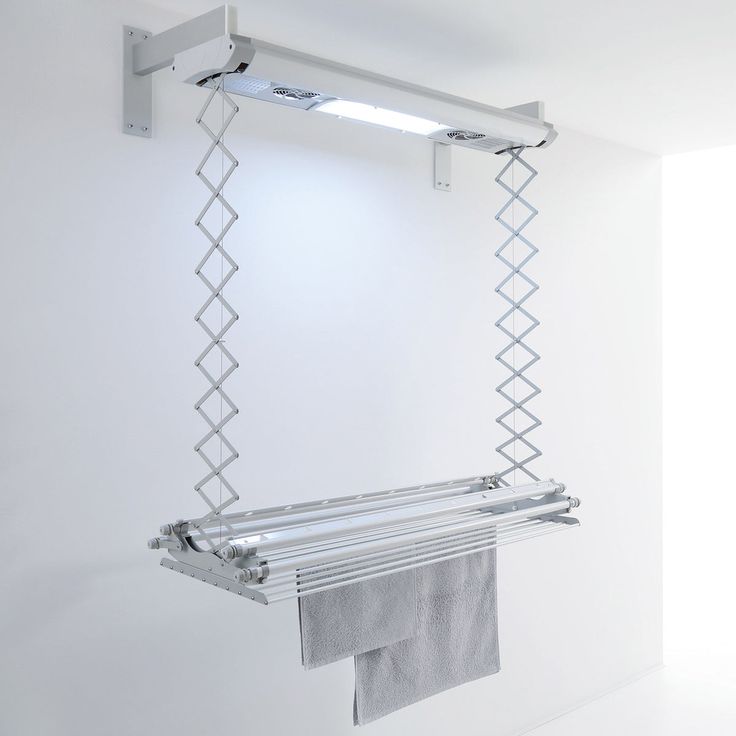 a towel rack hanging from the side of a wall