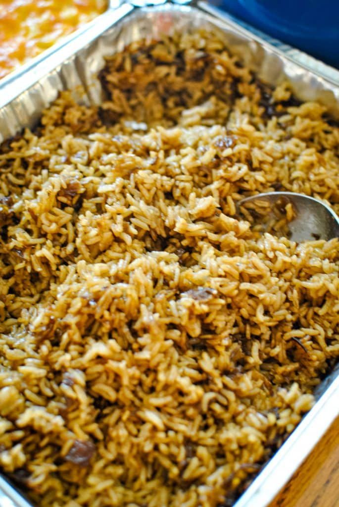 a casserole dish with rice and meat in it, ready to be eaten