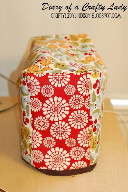 a red and white box sitting on top of a wooden table