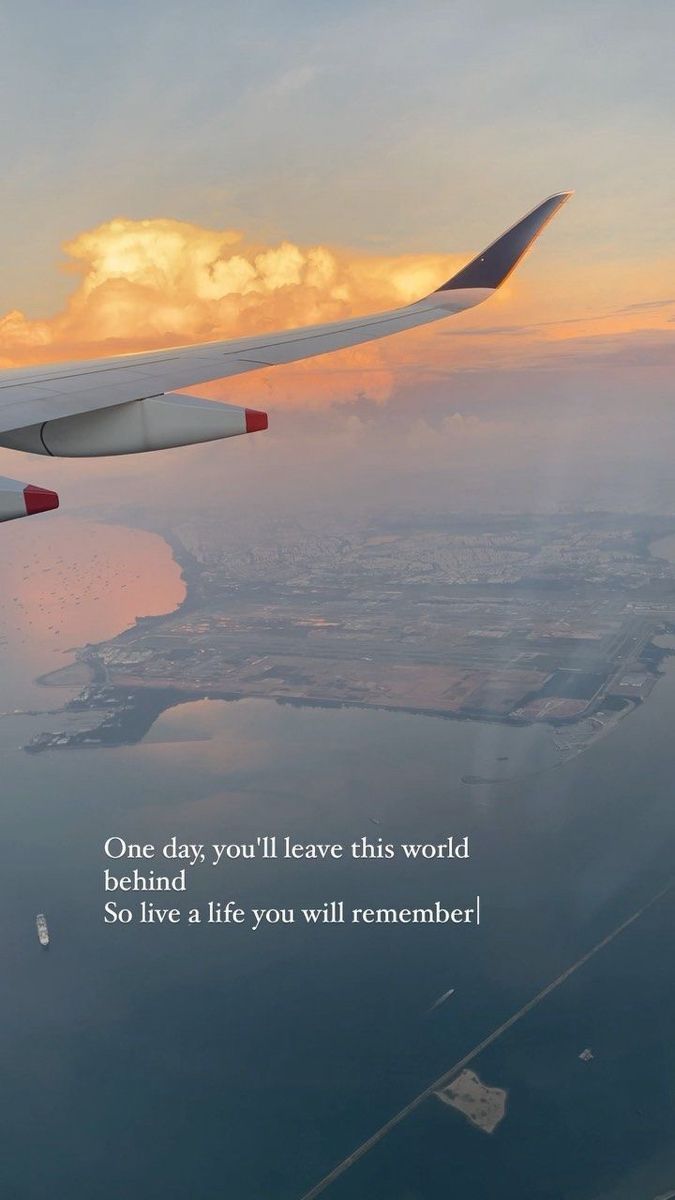 an airplane wing with the words one day, you'll leave this world behind so live a life you will remember