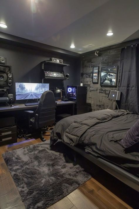 a bedroom with a bed, computer desk and speakers