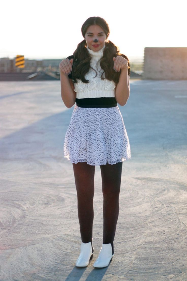 a young woman is posing for the camera