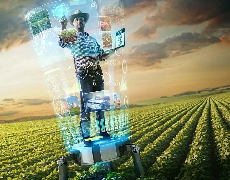 a man standing on top of a laptop computer in a field