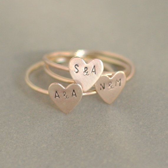 Our tiniest initials ever, on the sweetest little 14k gold filled heart. Personalize your heart with best friend, couples or kids initials. So dainty and adorable, its like wearing a secret keepsake. Our gold heart stacking ring is custom made to order in your size hand stamped with your letters. Shown with 1.5 mm uppercase letters. Font also available in 1.5 mm lowercase. See drop-down menu for additional initial options. ** This listing is for ONE gold heart initial ring. Use the drop-down... Personalized Dainty Midi Rings For Wedding, Simple Personalized Stackable Wedding Rings, Dainty Personalized Midi Rings For Wedding, Dainty Heart Charm Stackable Rings For Wedding, Dainty Stackable Rings With Heart Charm For Wedding, Dainty Stackable Wedding Rings With Heart Charm, Cute Gold Stackable Jewelry, Dainty Wedding Stackable Rings With Heart Charm, Cute Rose Gold Wedding Rings