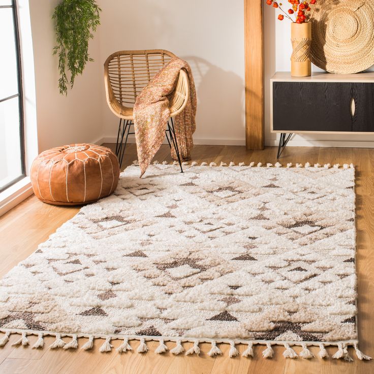 a living room with a rug and chair