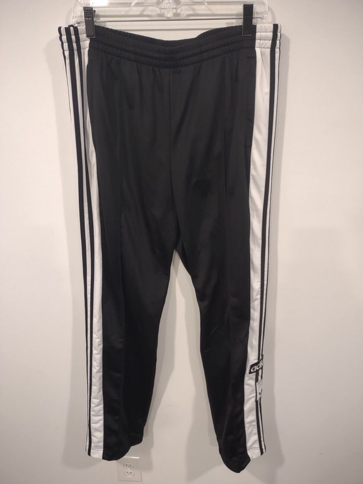 Adidas Adibreak Track Pants Size: Women's Large Measures about 31" inseam, 17" across the waist laying flat, and 8" opening at the bottom of the legs IB5924 Color: Black and White Brand New! HANDLING TIME IS SET FOR 5 BUSINESS DAYS TO ALLOW PAYMENT TO FULLY PROCESS. ONCE EBAY SENDS OUT THE FUNDS, THE ITEM WILL SHIP (WHICH IS USUALLY BEFORE 5 BUSINESS DAYS) ANY GROSS OVERCHARGE ON SHIPPING WILL BE REFUNDED Adidas Stretch Sweatpants For Spring, Sporty Stretch Straight Pants, Athleisure Stretch Pants With Side Stripes, Black Bottoms With Straight Hem For Streetwear, Casual Fitted Bottoms With Side Stripes, Fitted Casual Bottoms With Side Stripes, Casual Adidas Stretch Pants, Adidas Casual Relaxed Fit Pants, Casual Adidas Straight Leg Pants